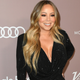 Illustration for article titled Despite a 'Misogynistic Society of Corporate Asses' Mariah Carey Is Thriving